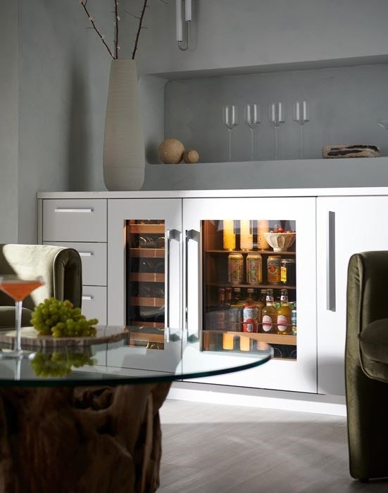 Panel Ready Sub-Zero 15 inch Designer Undercounter Wine Storage paired with a Wi-Fi ready Sub-Zero Designer Undercounter Beverage Center set in a custom sleek minimal European designed space